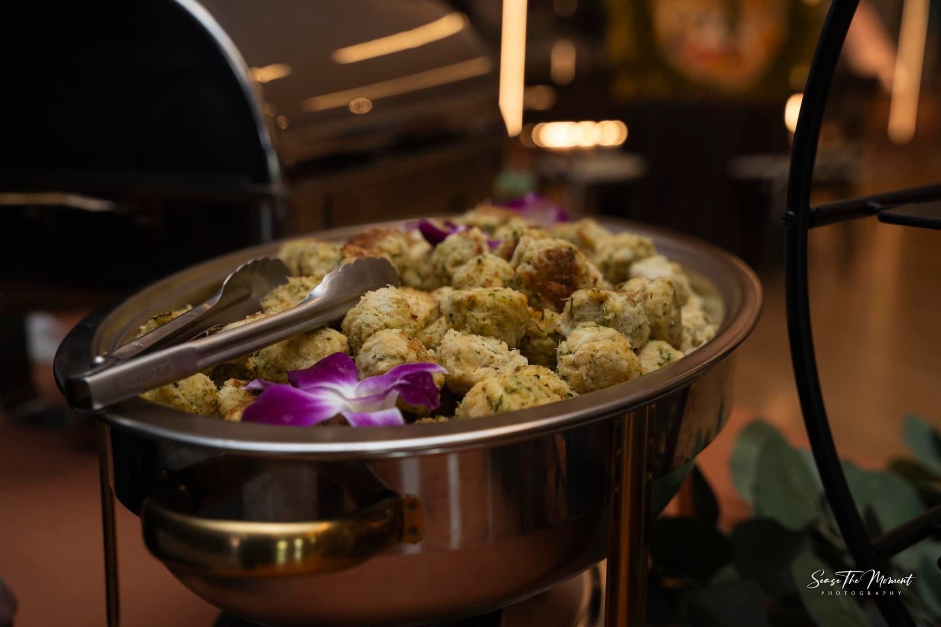 Crispy golden crab balls plated with sauce