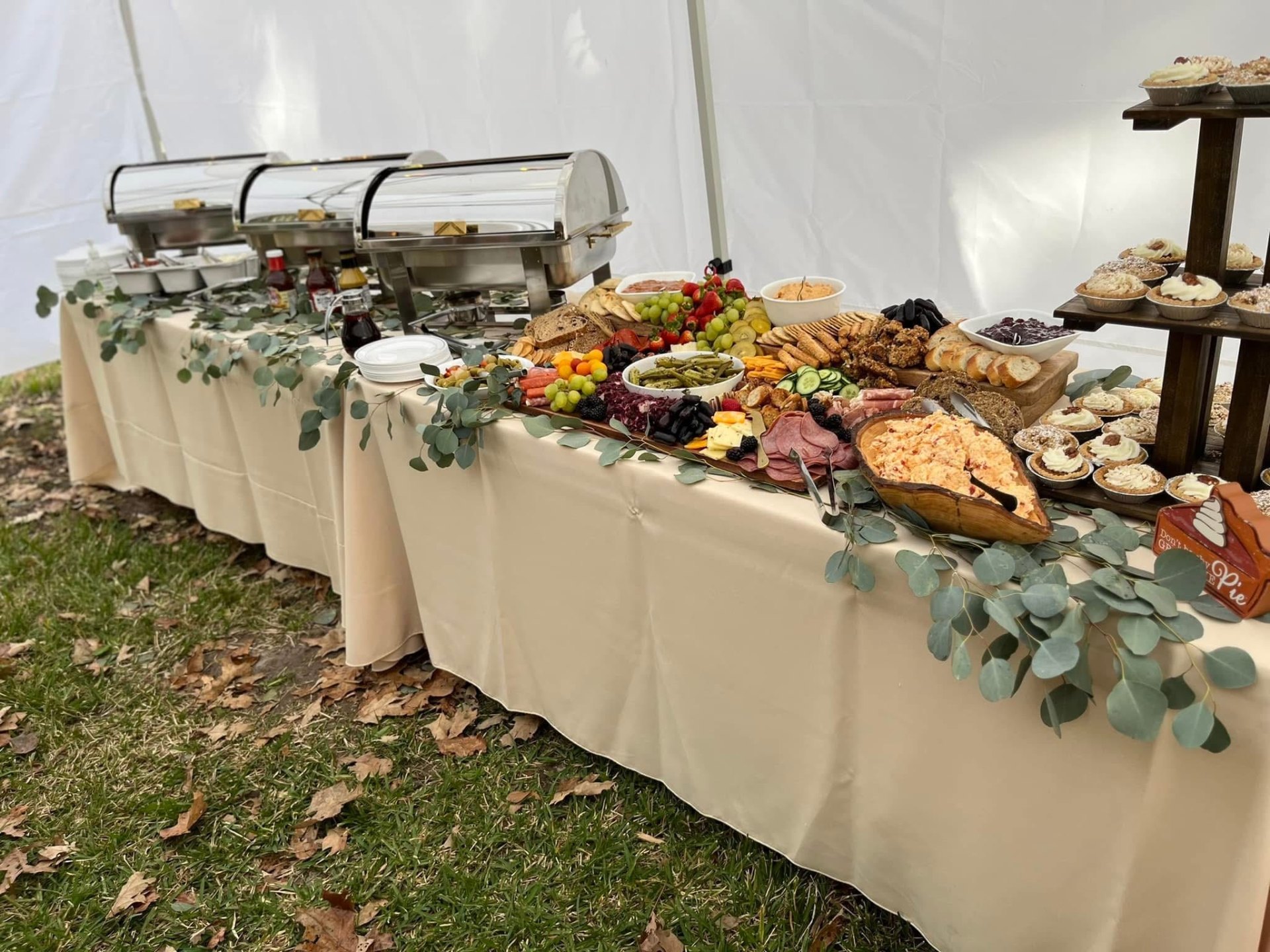 Full tented buffet with chafing dishes, grazing board and mini pies