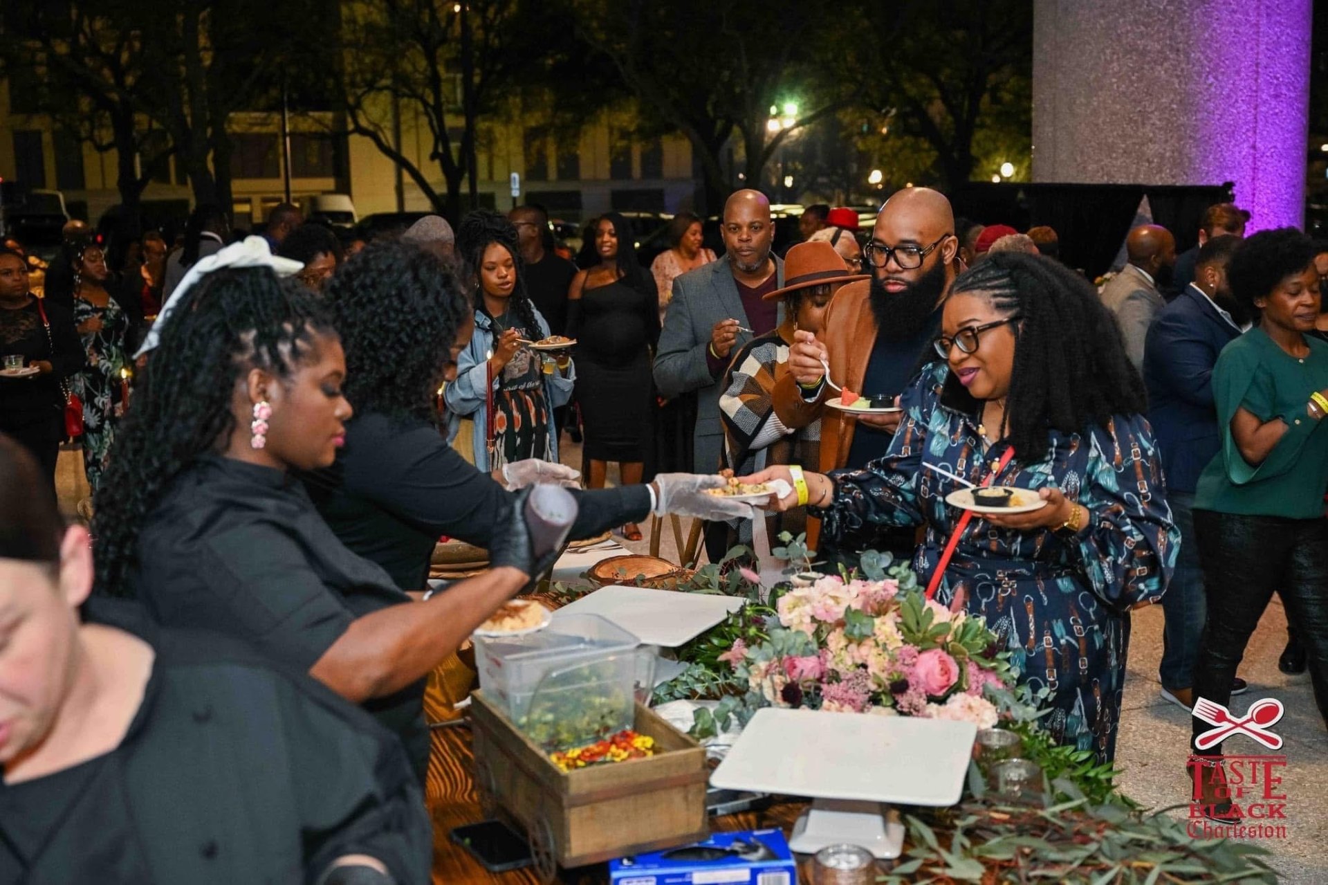 Chef team serving guests at the Taste of Black Charleston event