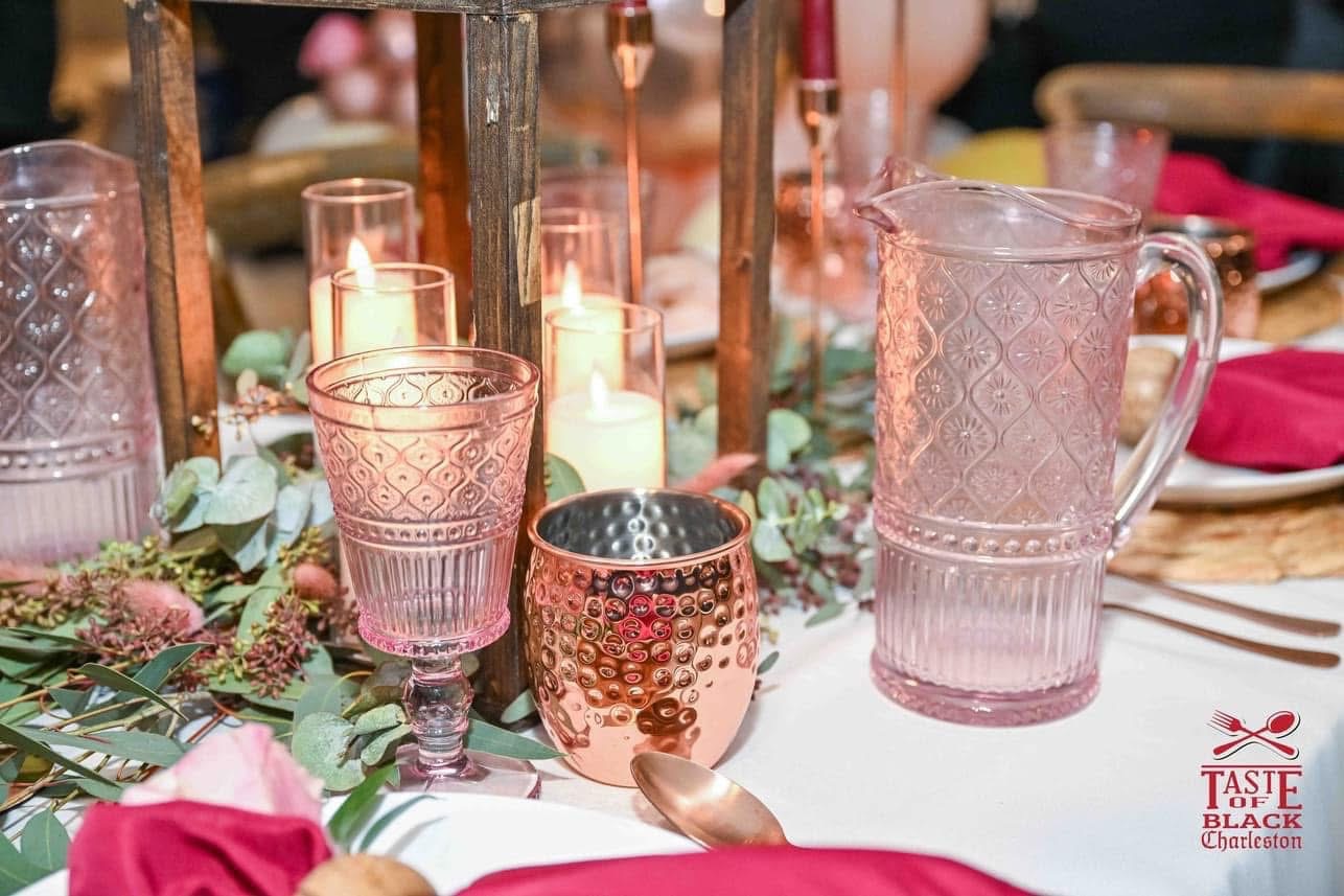 Blush pink glassware and copper cups with eucalyptus garland